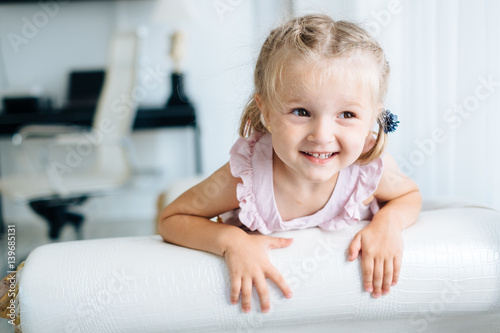 Cute girl holding head