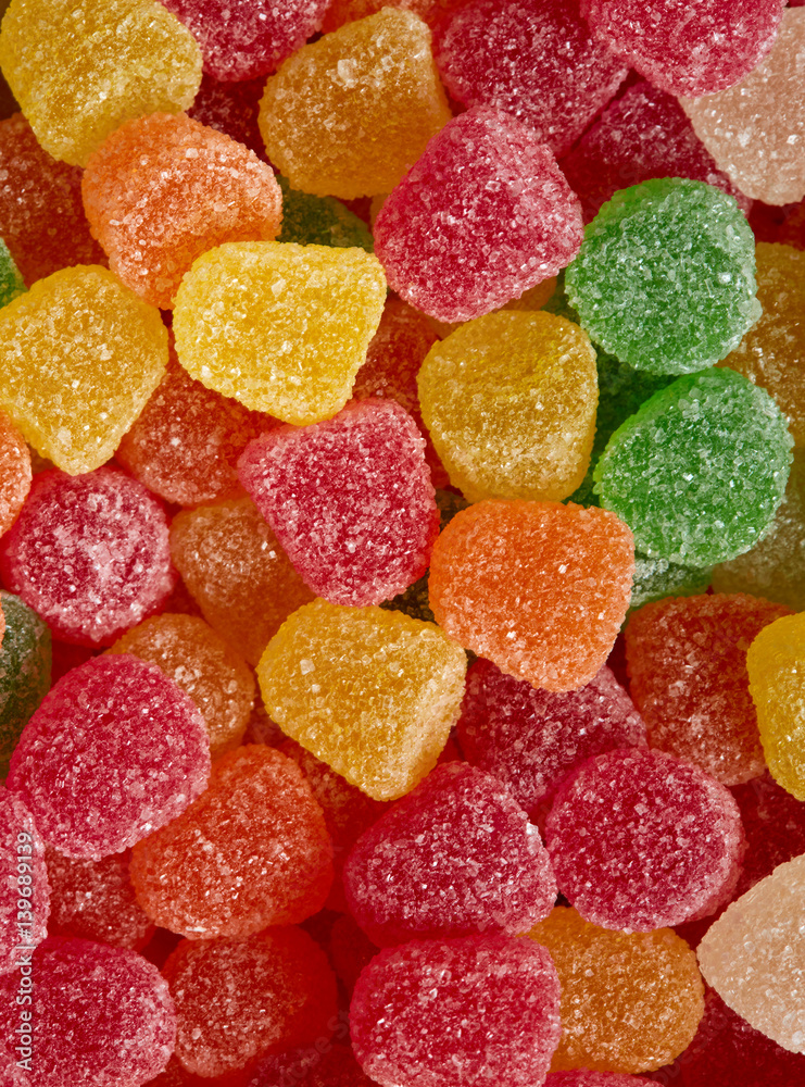 Multi-colored chewy gummy candy close up background Multi-colored chewy gummy candy close up background