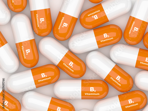 3d render of vitamin B3 pills on white table photo