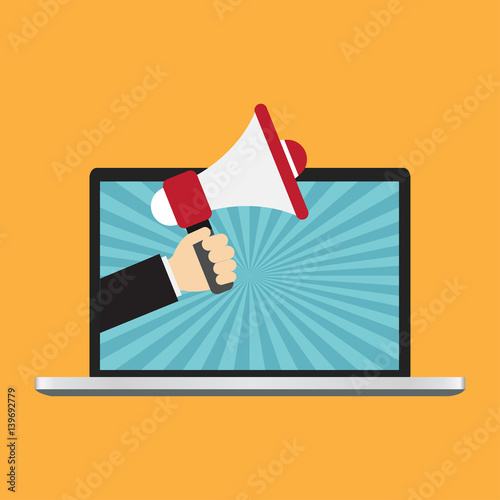 Businessman hand from laptop computer holding megaphone for advertising.