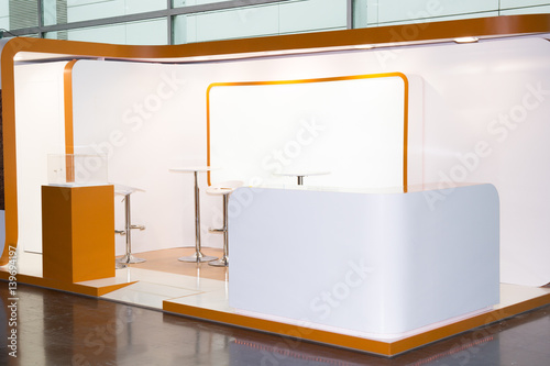 A commercial stand in an exhibition hall or a large professional salon ready to receive brands and advertisements photo