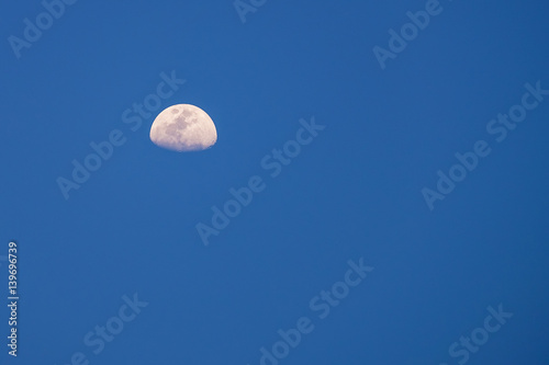 moon at blue sky during afternoon