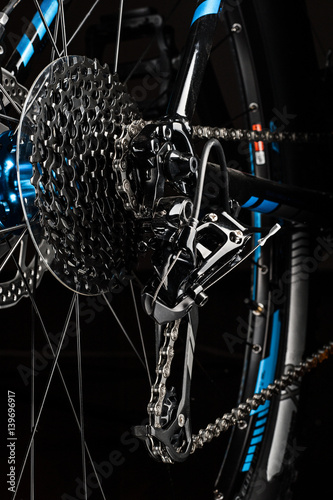 mountain bicycle gears system on dark background