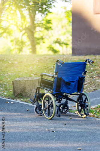 blank wheel chair in garden