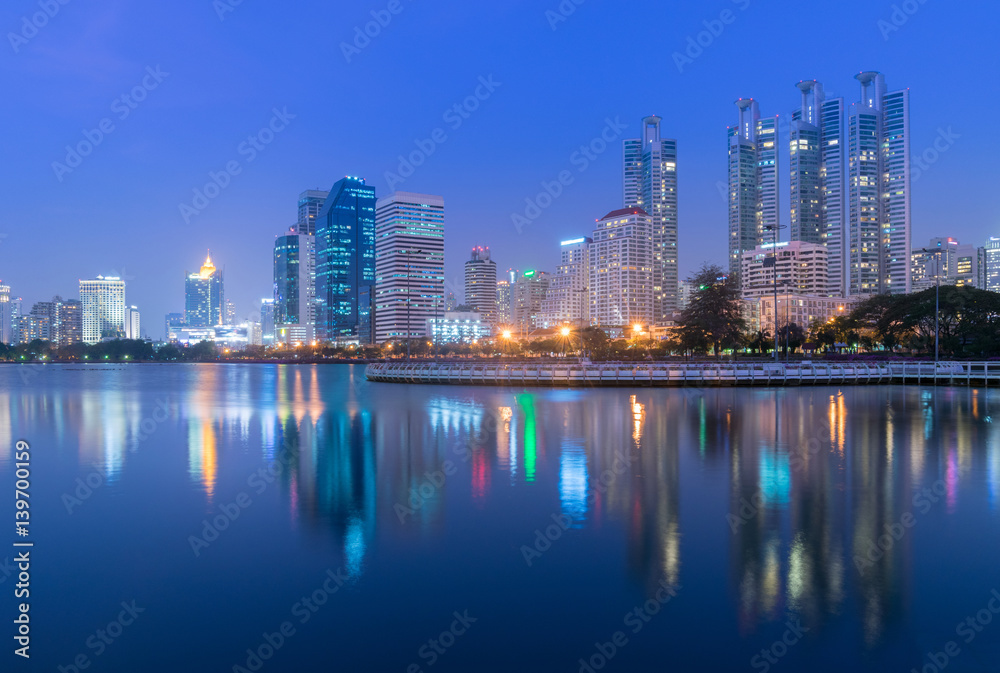 Bangkok city skyline at Benjakitti Park at night.