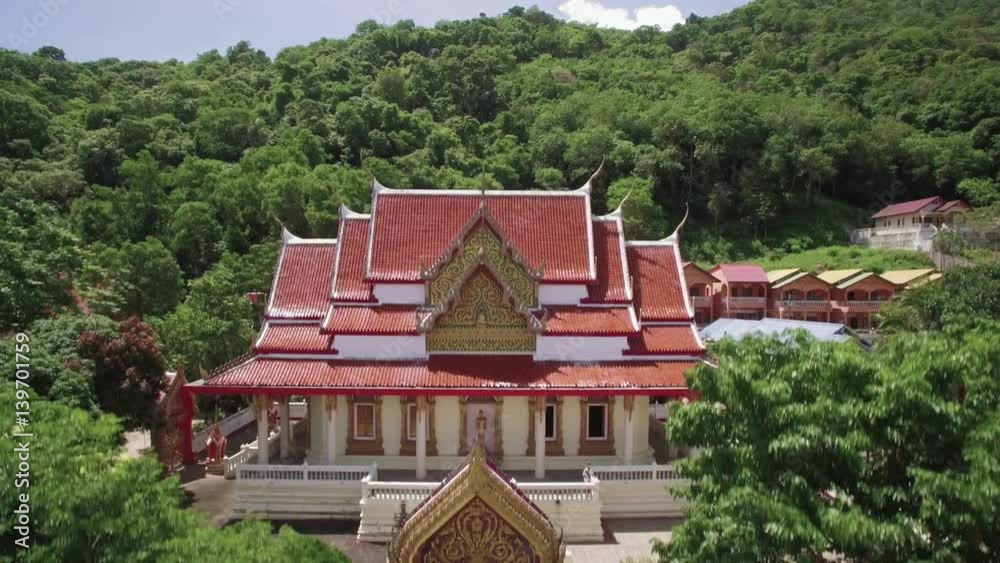 Buddhist Temple at the Foot of Rainforest Covered Hills in Phuket Thailand Aerial Footage
Buddhist Temple at the Foot of Rainforest Covered Hills in Phuket Thailand Aerial Footage