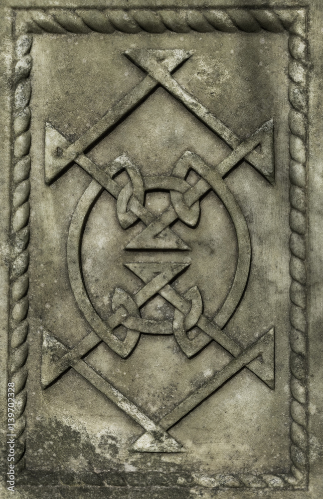 stone carved Celtic design symbols background