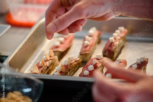 Close-up of male hands preparing molecular dish