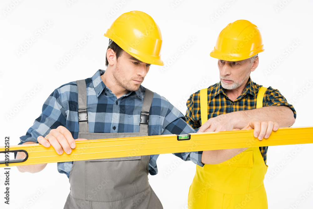 Workmen with level tool Workmen with level tool