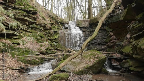 slow motion shot of a river flow / waterfall photo