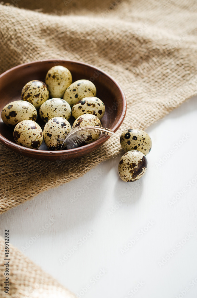 Fresh Organic Quail Eggs in a Ceramic Bowl.