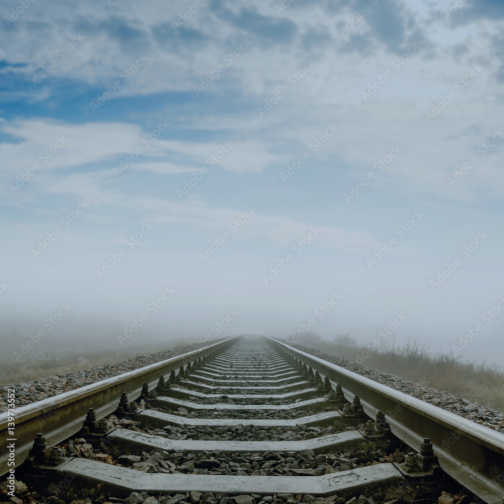 railroad in fog to horizon. soft focus