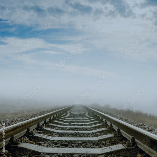 railroad in fog to horizon. soft focus