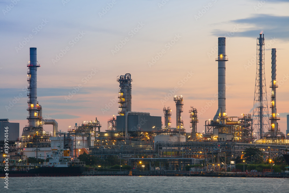 Oil refinery plant industry at dramatic twilight