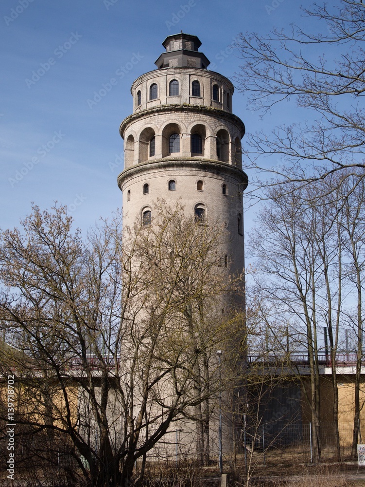 Old water storage tower with arched windows