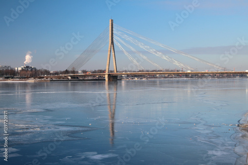 Fototapeta Naklejka Na Ścianę i Meble -  Guy cable bridge through Daugava River. Riga, Latvia
