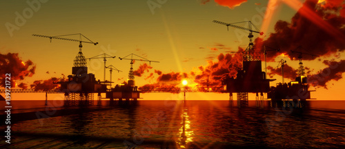 Image of oil platform during sunset. photo