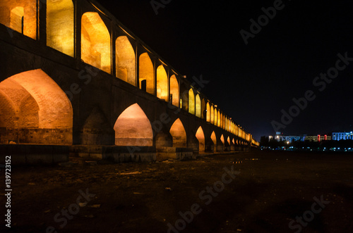 Famous historic Khaju bridge at night in Esfahan, Iran.