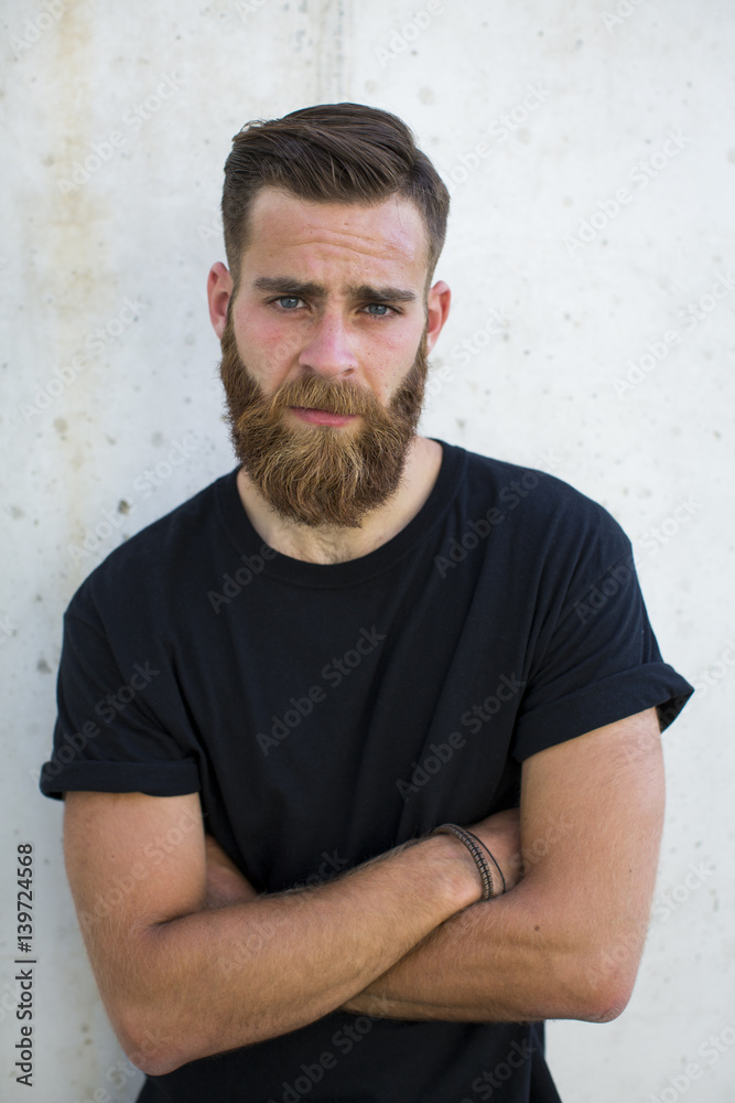 Bearded man posing in the street. Bearded man posing in the street.