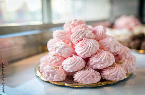 Pink meringues in a candy shop