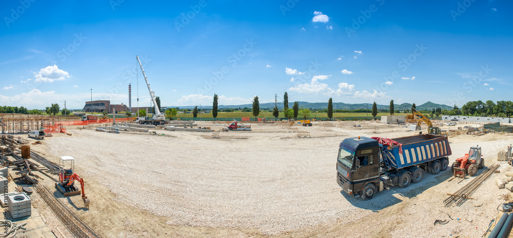 Works in progress on costruction site, panoramic view Works in progress on costruction site, panoramic view