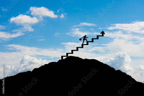 Businessman stepping up a stairway, Success concept