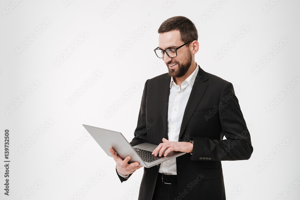 Happy businessman using laptop computer. Happy businessman using laptop computer.