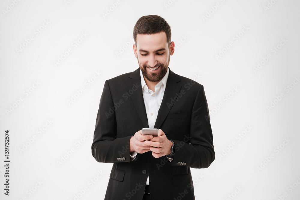 Happy businessman chatting by mobile phone. Happy businessman chatting by mobile phone.