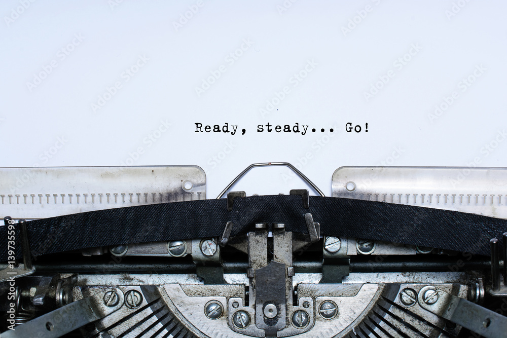 ready. steady. go. slogan taped words on a vintage typewriter ready. steady. go. slogan taped words on a vintage typewriter