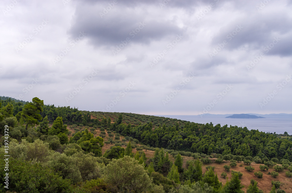 Cloudy sky over the hills and sea in Sithonia, Chalkidiki, Greece
