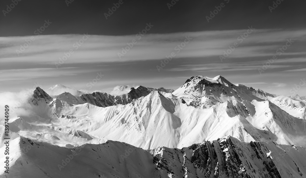 Black and white panorama of snowy mountains in winter