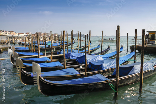 Gondolas moored in front of Saint Mark square in Venice