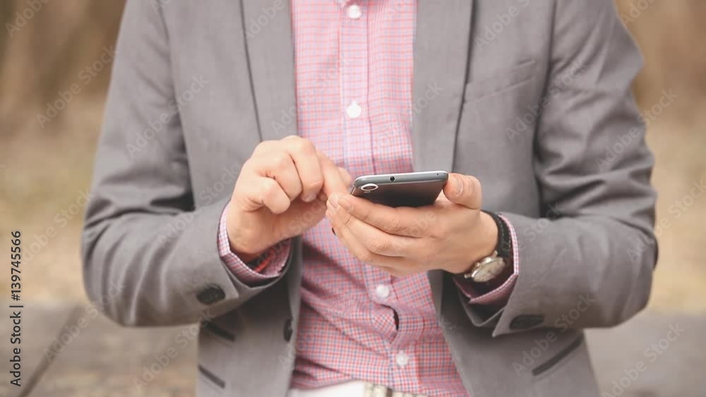 Man using cellphone outdoors. Man using cellphone outdoors.