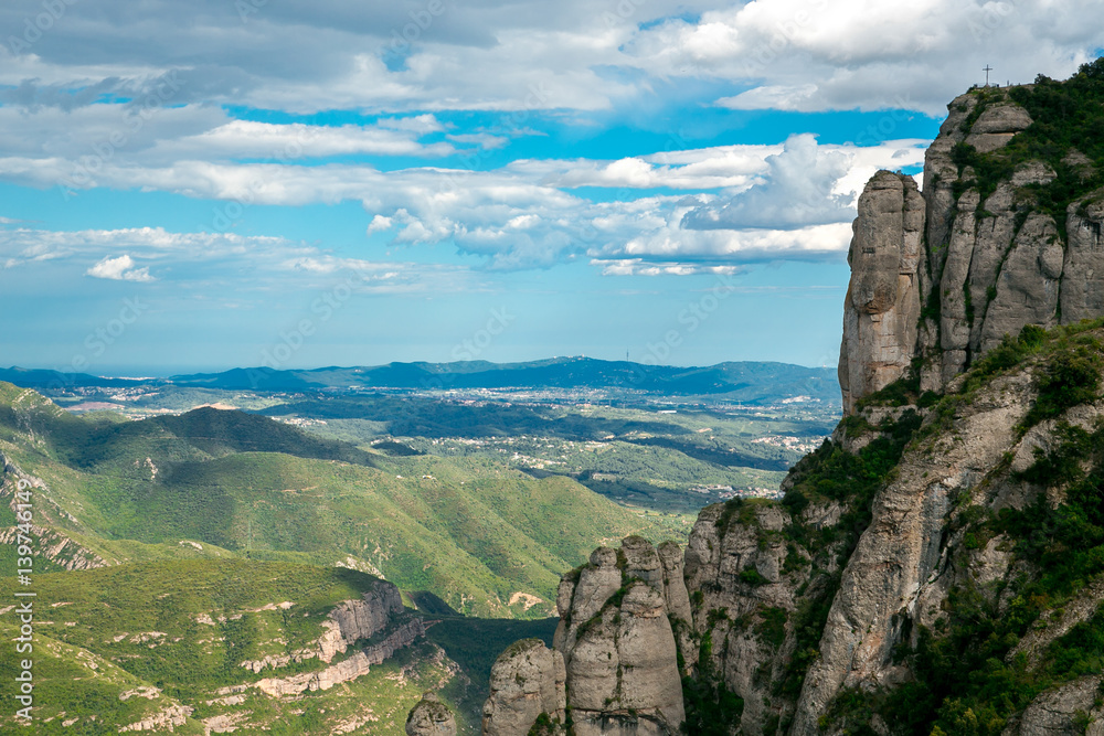 View of the Montserrat mountain and the cross. Spain, Barcelona.