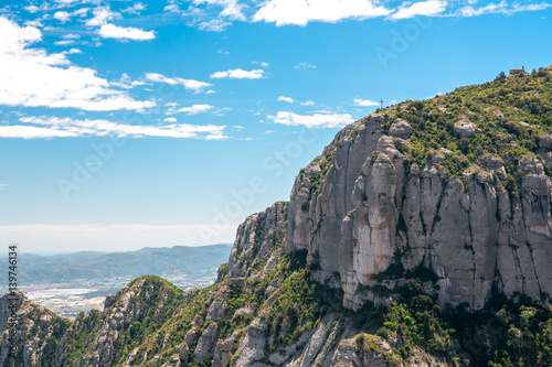 View of the Montserrat mountain and the cross. Spain, Barcelona.