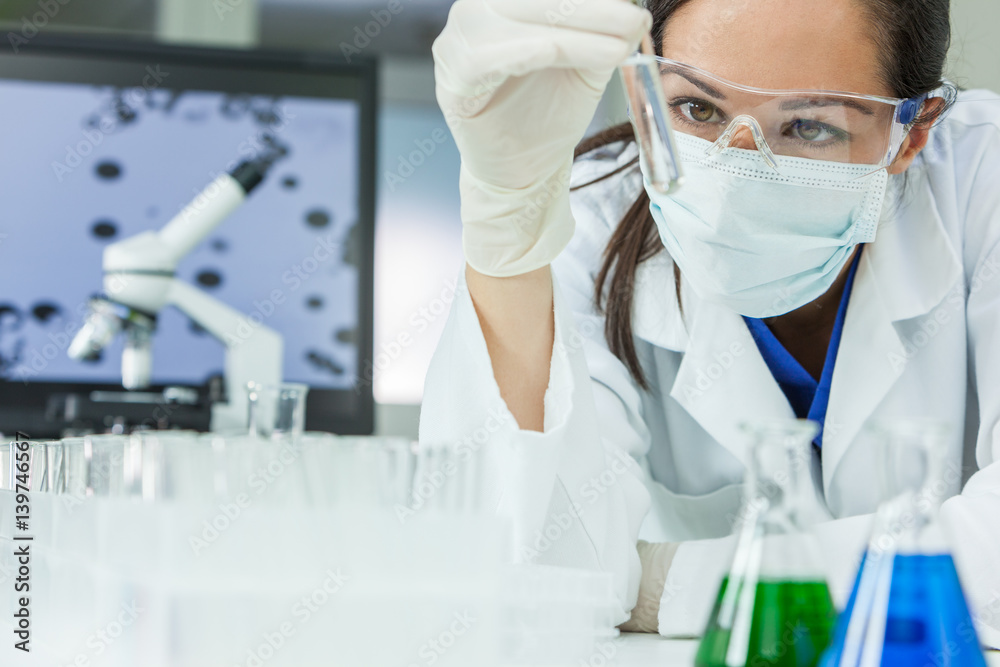 Female Woman Research Scientist With Test Tube In Laboratory Female Woman Research Scientist With Test Tube In Laboratory