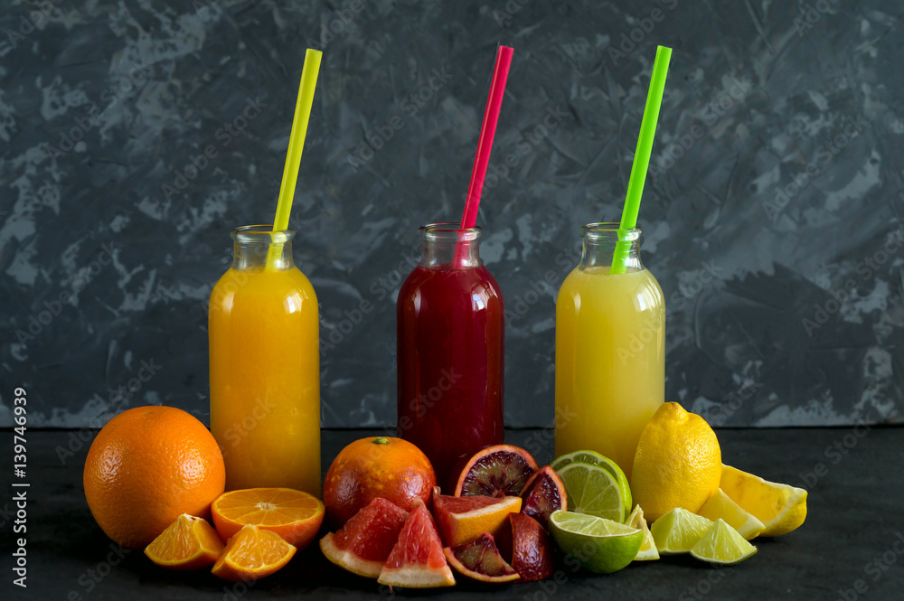 Fresh juice from citrus on a dark background Fresh juice from citrus on a dark background