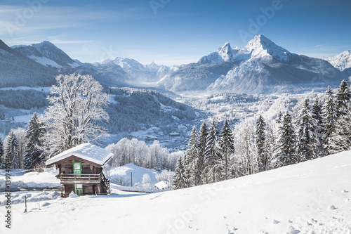 Winter wonderland in the Alps with traditional mountain chalet © JFL Photography