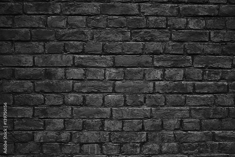 black brick wall, urban exterior weathered surface as background