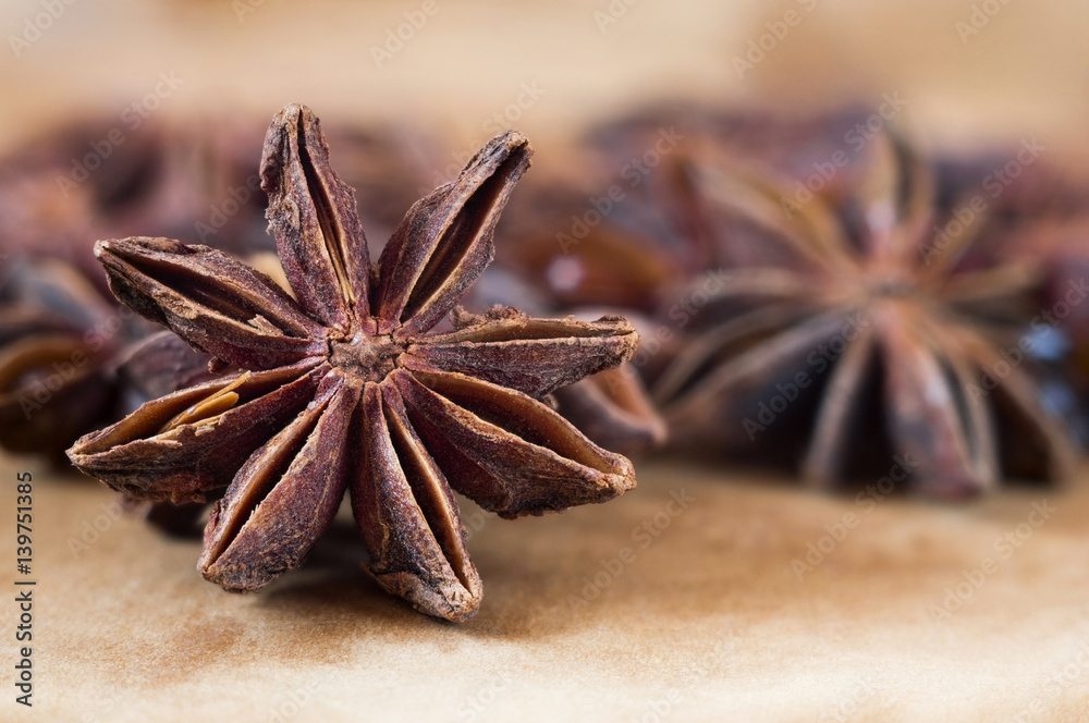 A retro looking star anise background in brown tones. A retro looking star anise background in brown tones.