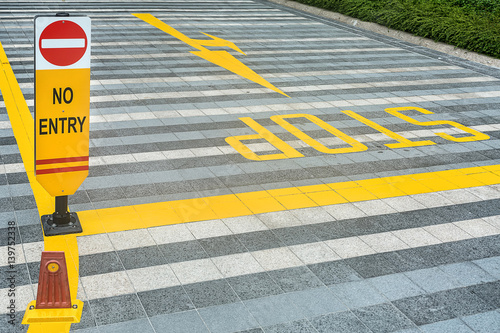 Yellow road marking on pave