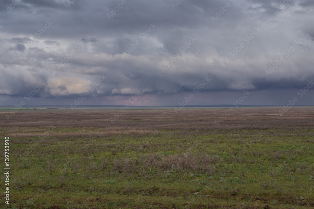 Obraz premium Clouds over the steppe.