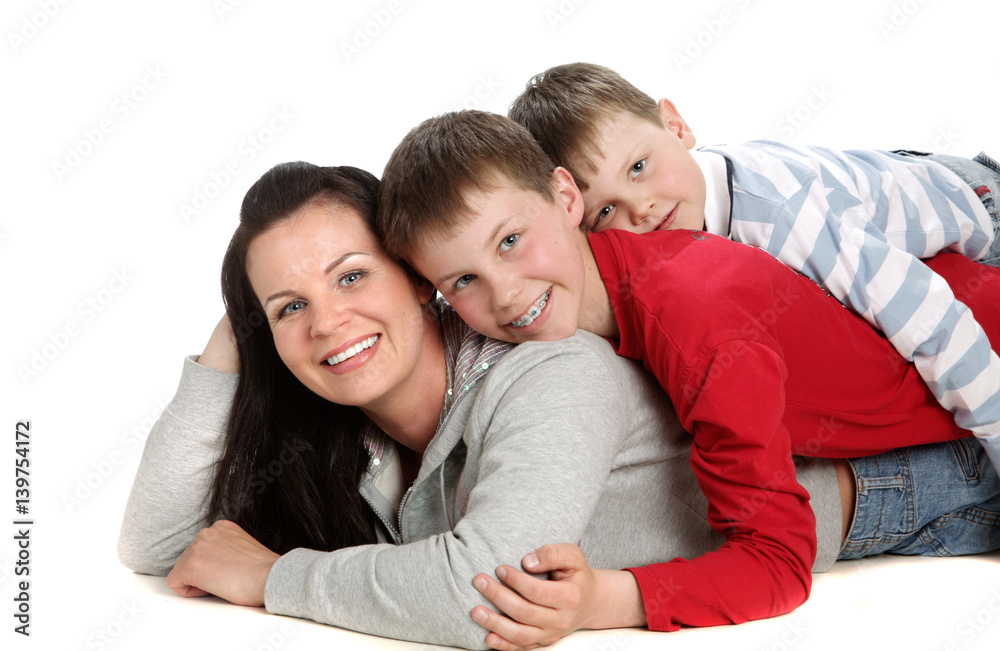 Two Son Smiling And Hugging Her Mother Two Son Smiling And Hugging Her Mother
