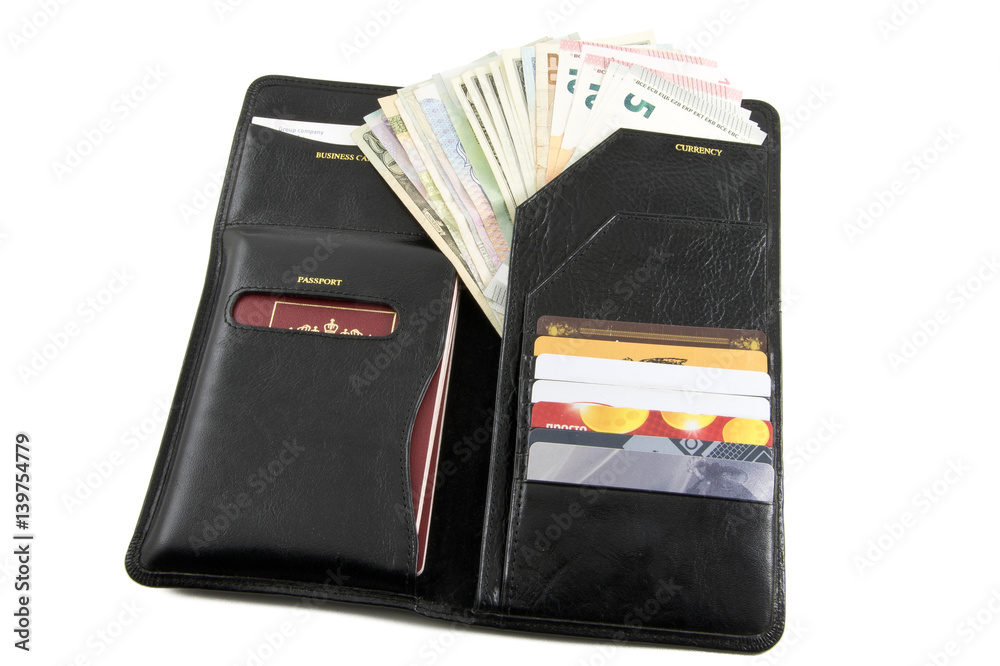 Photo set for the traveller: purse, credit cards, passports and money from different countries Photo set for the traveller: purse, credit cards, passports and money from different countries