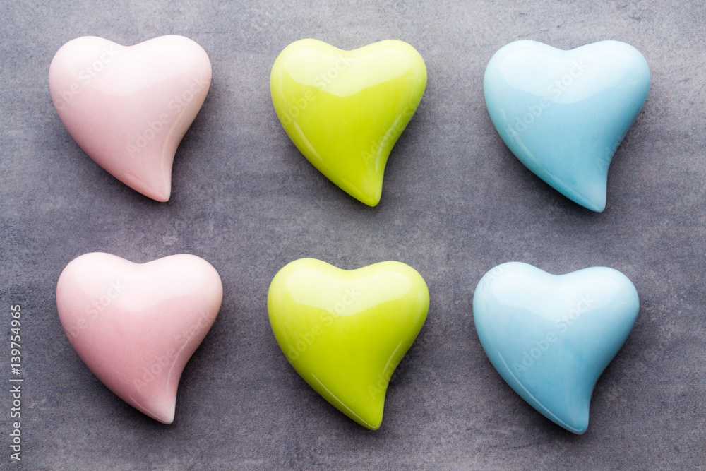 Colored heart on the gray background. View from above. Flat lay.