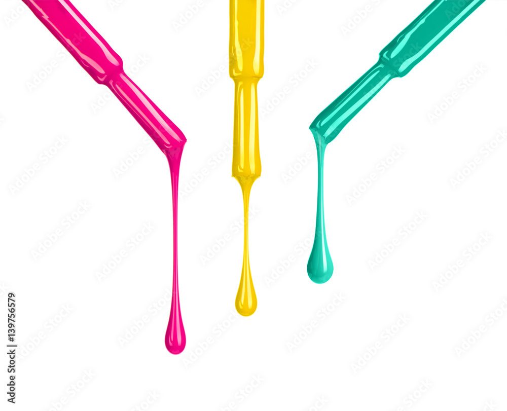 Colored nail polishes dripping from brushes isoalted on white background