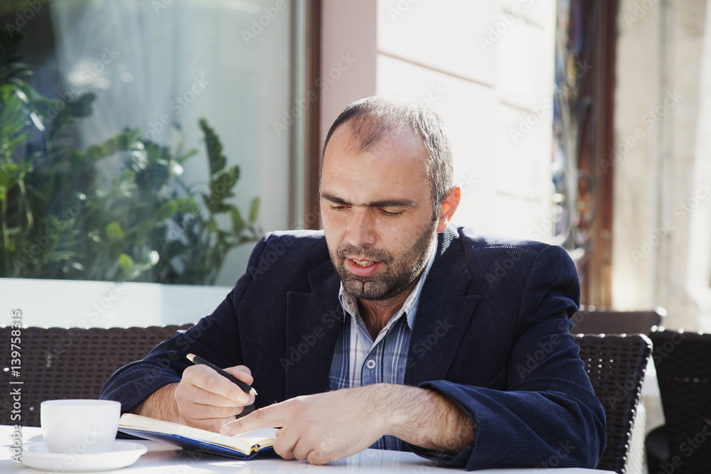 businessman planning his workday. Time management concept. (Freedom, freelance, success, money) businessman planning his workday. Time management concept. (Freedom, freelance, success, money)