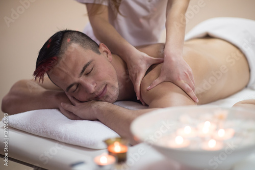 young man having a back massage