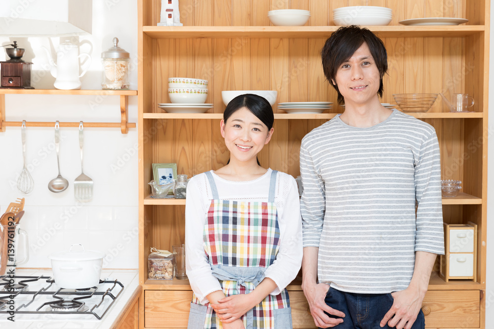 portrait of young asian couple in the kitchen portrait of young asian couple in the kitchen