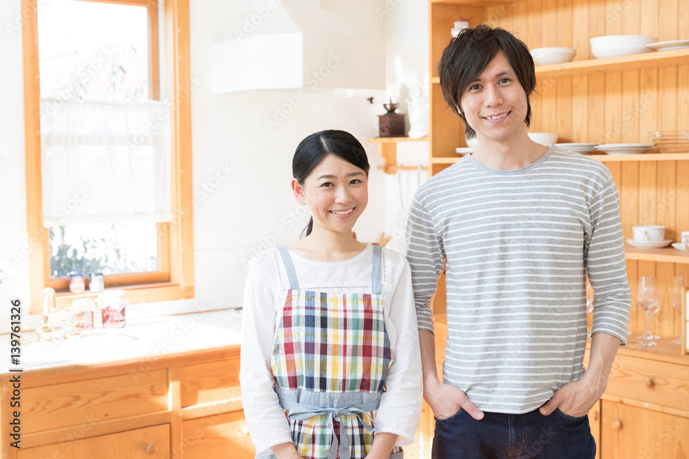 portrait of young asian couple in the kitchen portrait of young asian couple in the kitchen